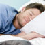 man sleeping bed blanket