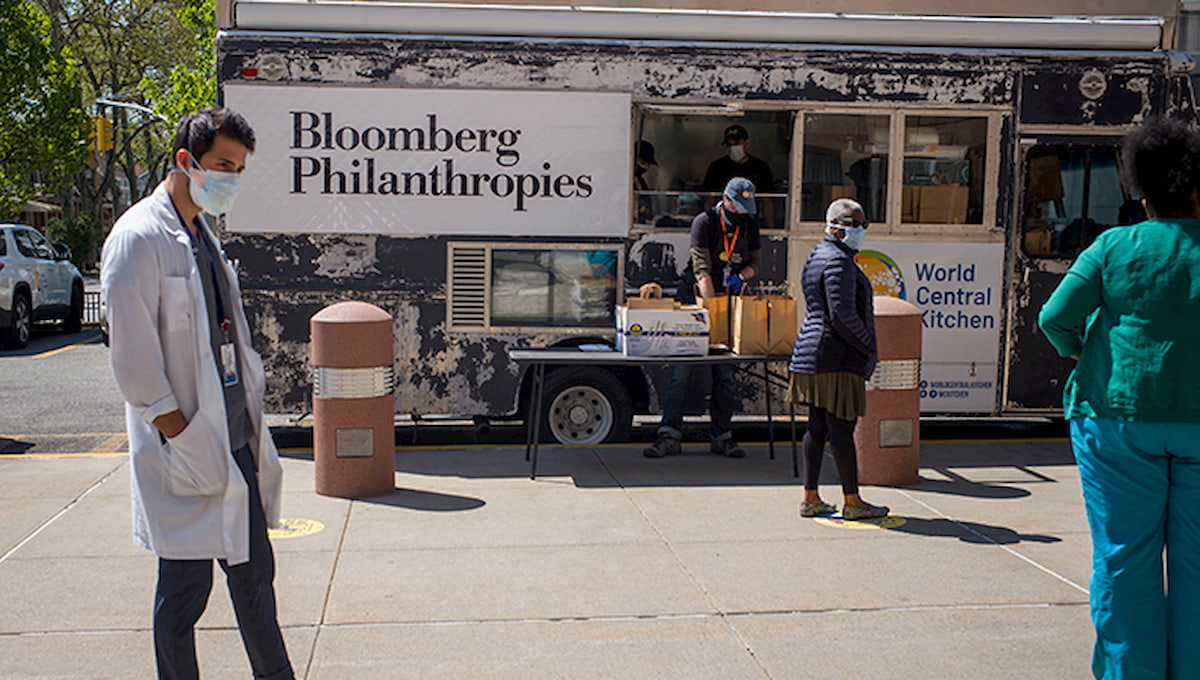 During the COVID-19 pandemic, World Central Kitchen and Bloomberg Philanthropies have teamed up to feed hospital staff at Kings County Hospital in Brooklyn. Doctors and nurses line up at food trucks to take bags of meals to their coworkers inside the hospital.