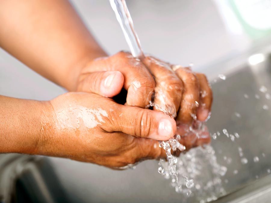 Hand washing. Healthcare worker washing hands in hospital sink under running water. contagious diseases wash hands, handwashing hygiene, virus, human health