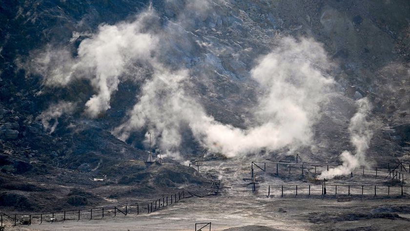 A smoking volcanic crater at Campi Flegrei in Italy.