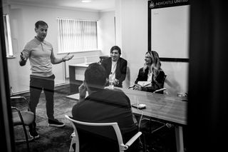 Newcastle United new signing Sandro Tonali smiles at a meeting with Newcastle United's Sporting Director Dan Ashworth (L) on July 06, 2023 in Newcastle upon Tyne, England.