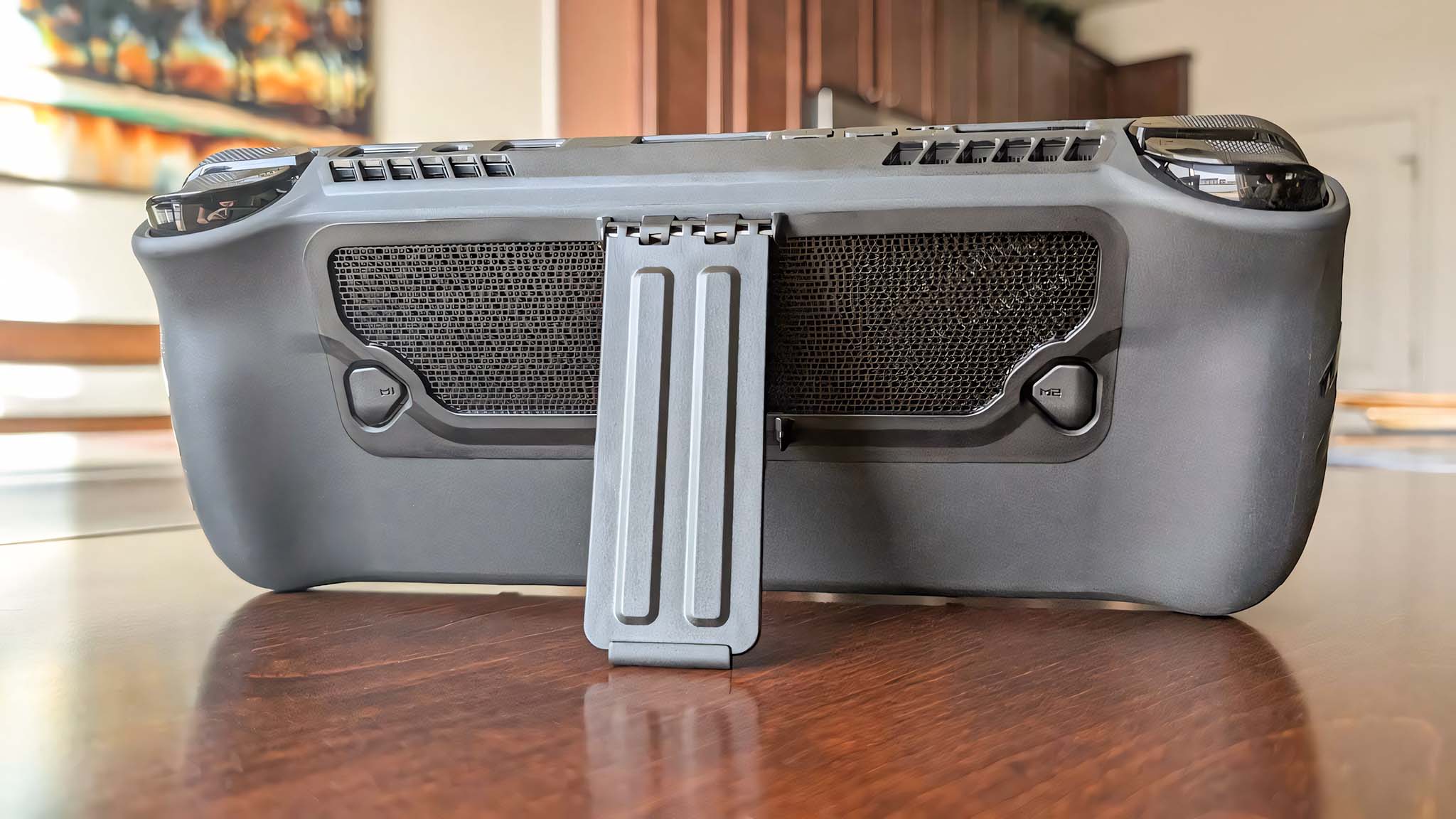 Backside of the dBrand Killswitch while attacked to the ROG Ally X, focusing on the back buttons and kickstand.