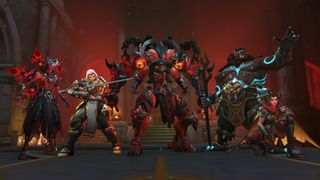 Five video game characters in fantasy armor pose in a dimly lit hall. The scene is intense, with a red glow and detailed, intricate costumes.