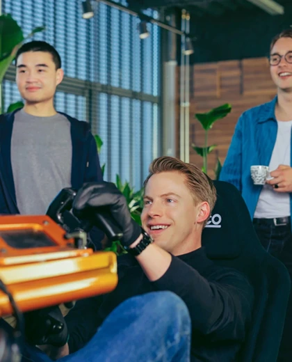 About Cloud86 10 employees having fun with formula 1 racing simulator