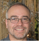 Happy man with glasses who is a LIM Lessons language learner