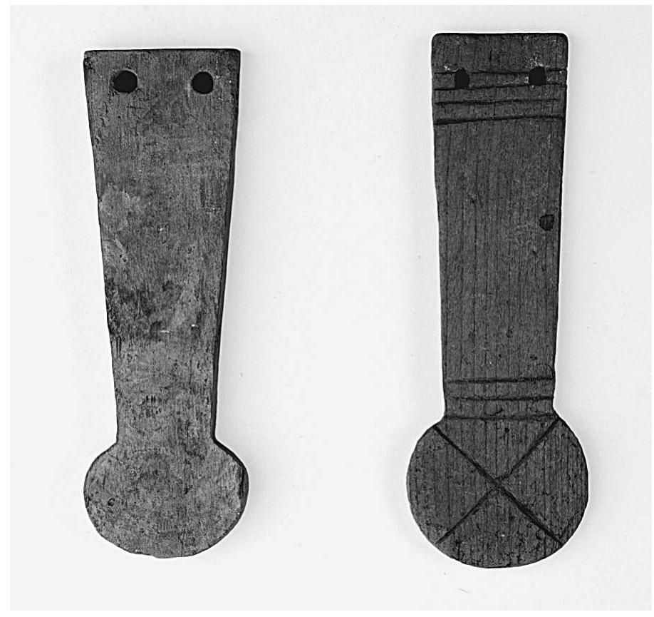 Fig. 16. Two of the many model menat necklace-counter poises from Deir el-Bahari (MMA 23.3.85 and 23.3.86. Rogers Fund, 1923). Photograph courtesy of the MMA. 