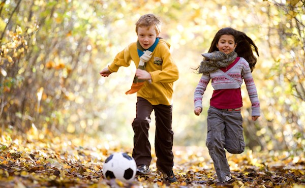 Kids playing in leaves