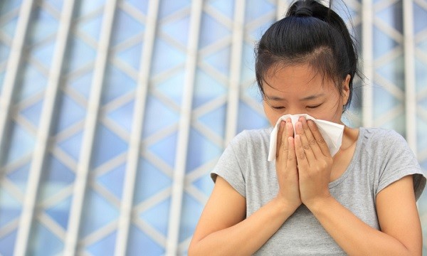 Woman with nosebleed