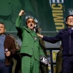 Joe Russo, Robert Downey Jr., and Anthony Russo speak onstage during the Marvel Studios Panel in Hall H at SDCC in San Diego, California on July 27, 2024