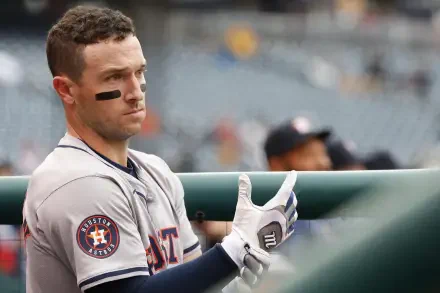 Alex Bregman of the Houston Astros prepares for action, showcasing his determination in a high-definition baseball moment. Ideal HD wallpaper for MLB fans.