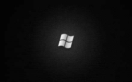 A sleek HD desktop wallpaper featuring the Windows 7 logo on a textured black background, emphasizing a modern technology aesthetic.