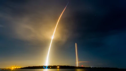 Time-lapse HD wallpaper capturing SpaceX Falcon 9 rocket launch and landing, showcasing advanced technology against a night sky.