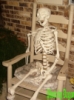 skeleton in chair.