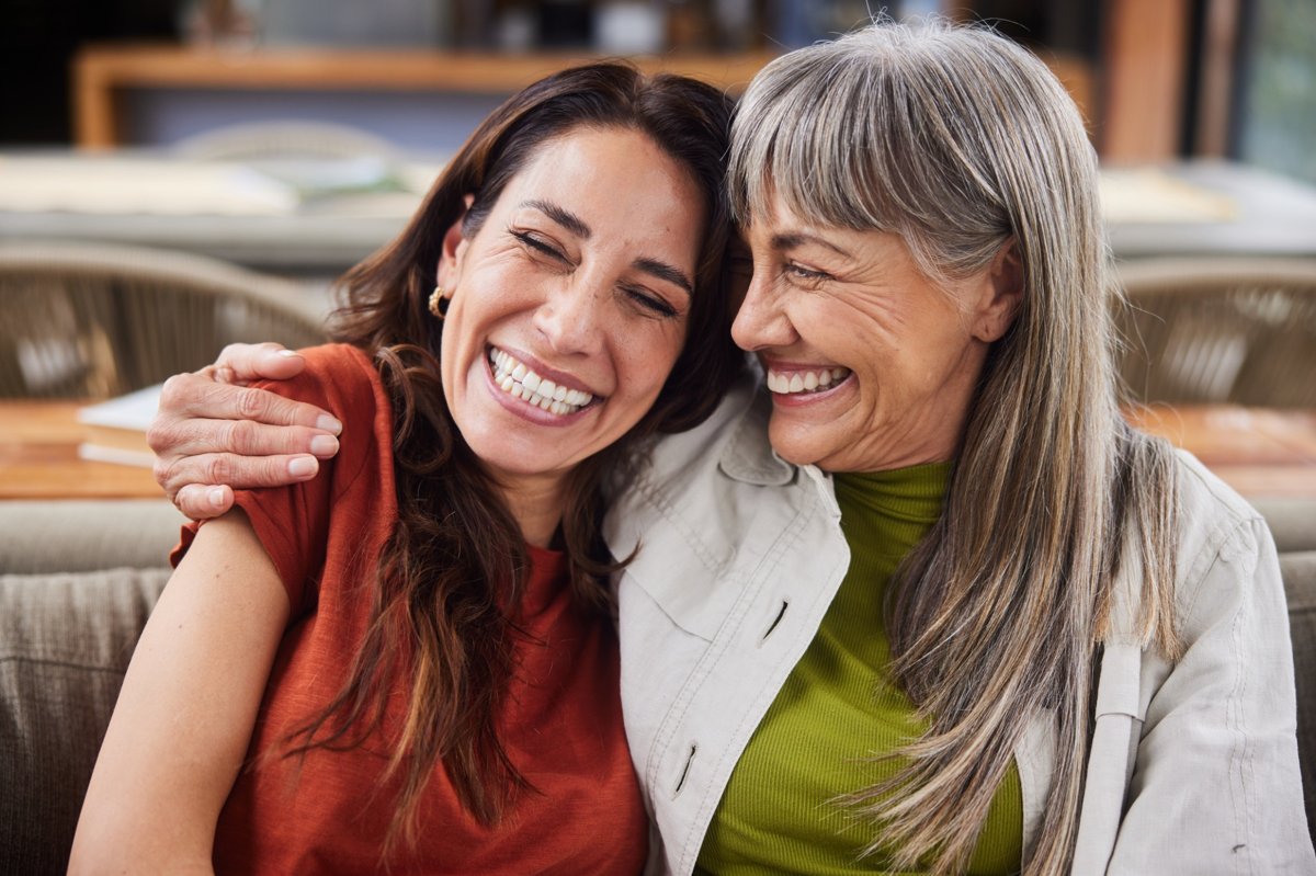 Daughter and mother smiling