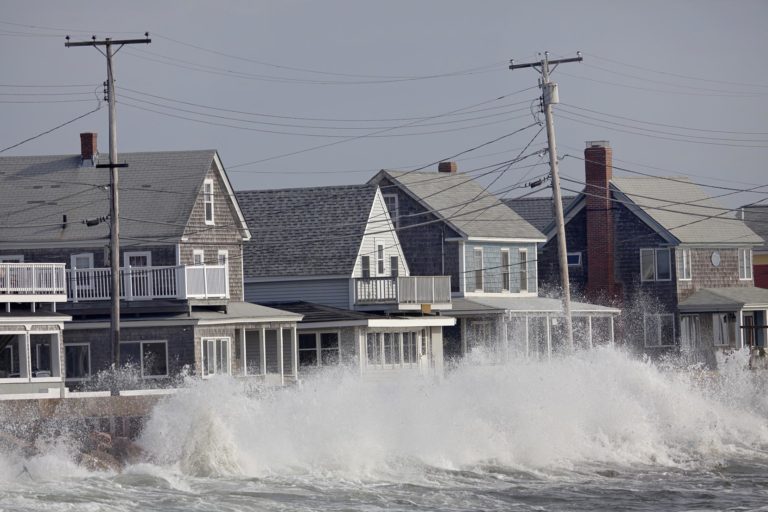 Ocean Storm Waves Crashing into Seawall in front of Houses