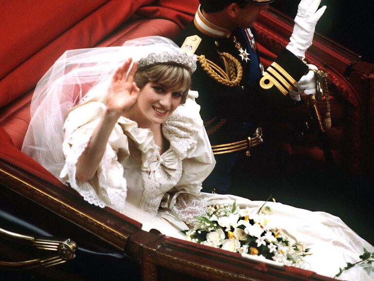 Princess Diana wears a modern fringe tiara and waves at the camera. 