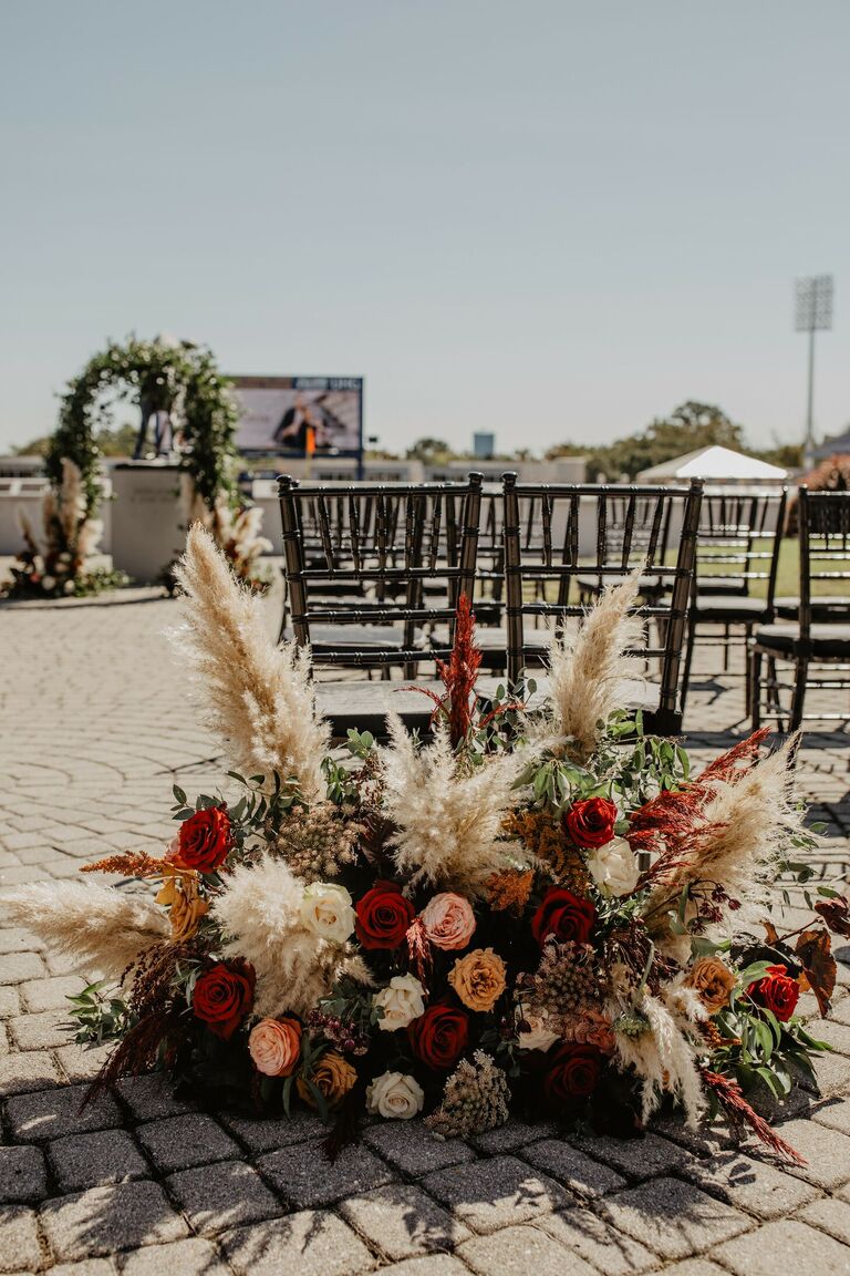 Pampas grass ceremony aisle arrangement