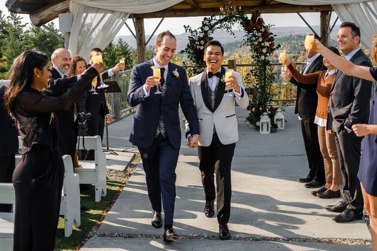 Grooms walking down the aisle at Canadian wedding