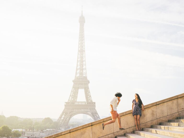 Couple in front of Eiffel Tower in Paris