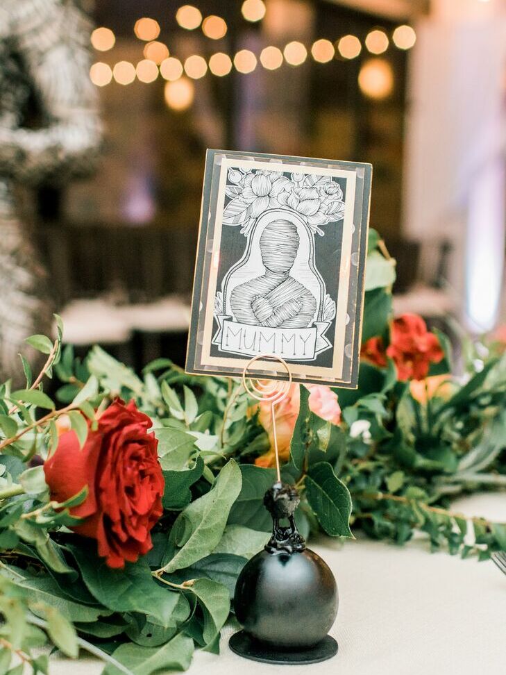 Mummy table name cards at a Halloween wedding