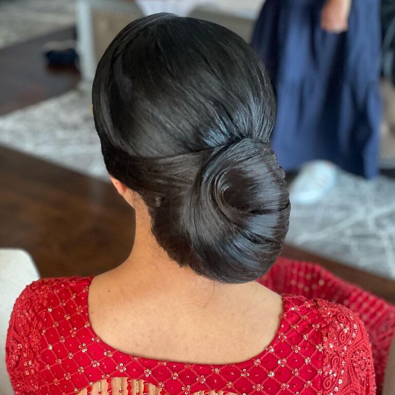 Voluminous Low Bun bridesmaid updo hairstyle