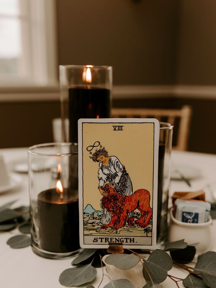 Tarot card table numbers at a Halloween wedding