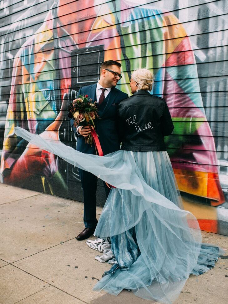 Bride wearing Halloween-themed leather jacket