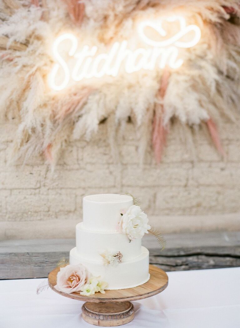 Three-tier cake with wood cake stand