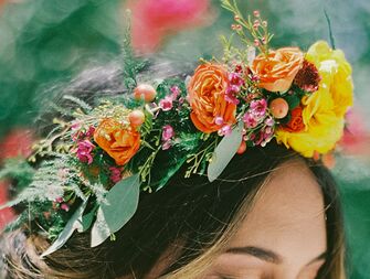 Bright bohemian flower crown with orange and yellow roses