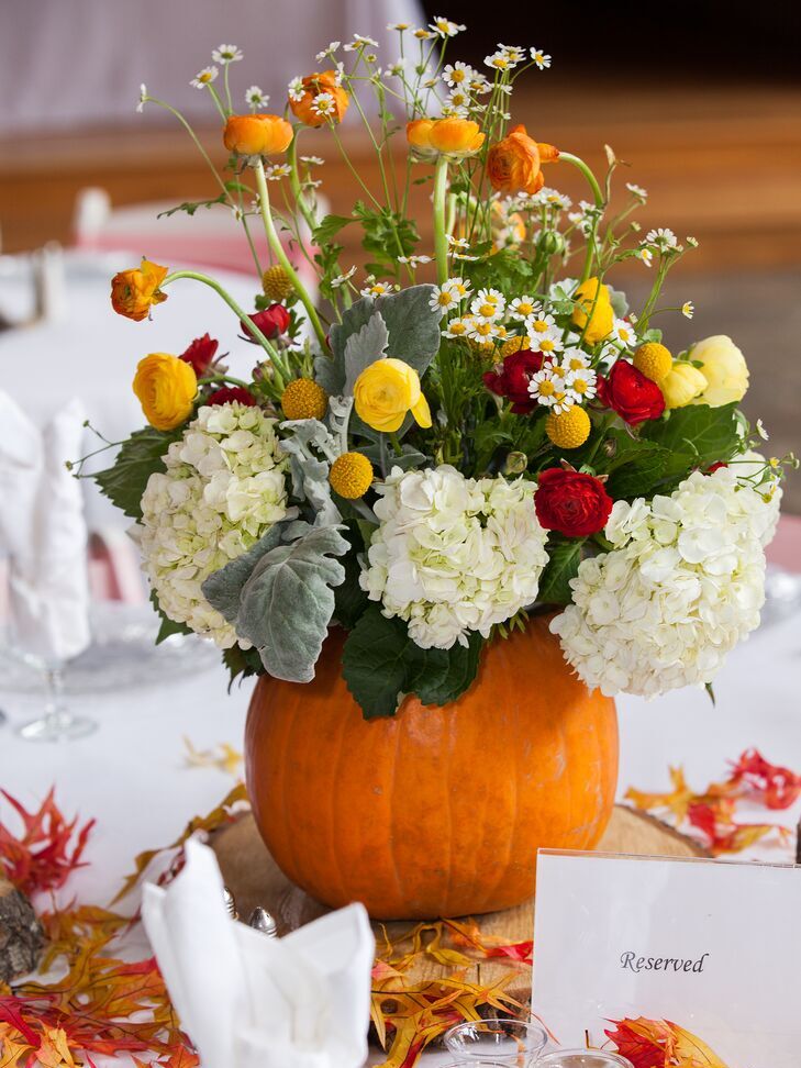 Pumpkin floral centerpieces at a Halloween wedding