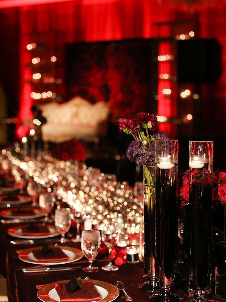 Gold, black, and crimson color scheme at a Halloween-themed wedding