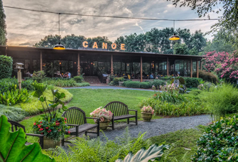 The sun sets on the tranquil setting of Canoe, where benches wait for visitors to stay awhile.