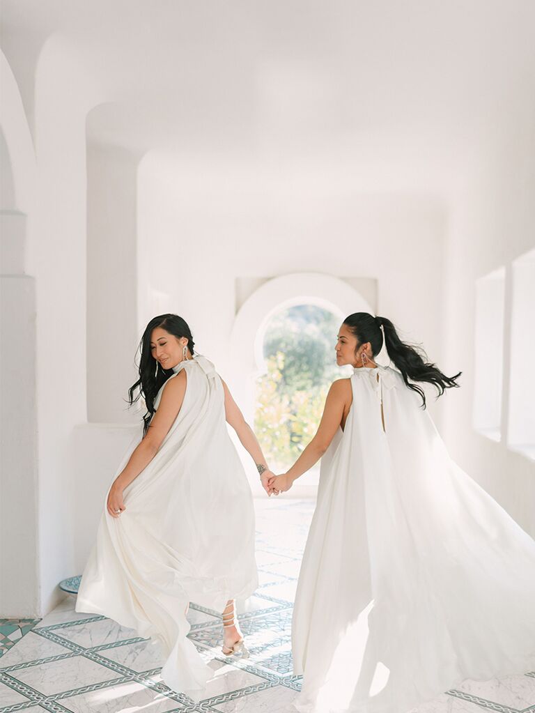 Two brides, one with a ponytail and one with hair down