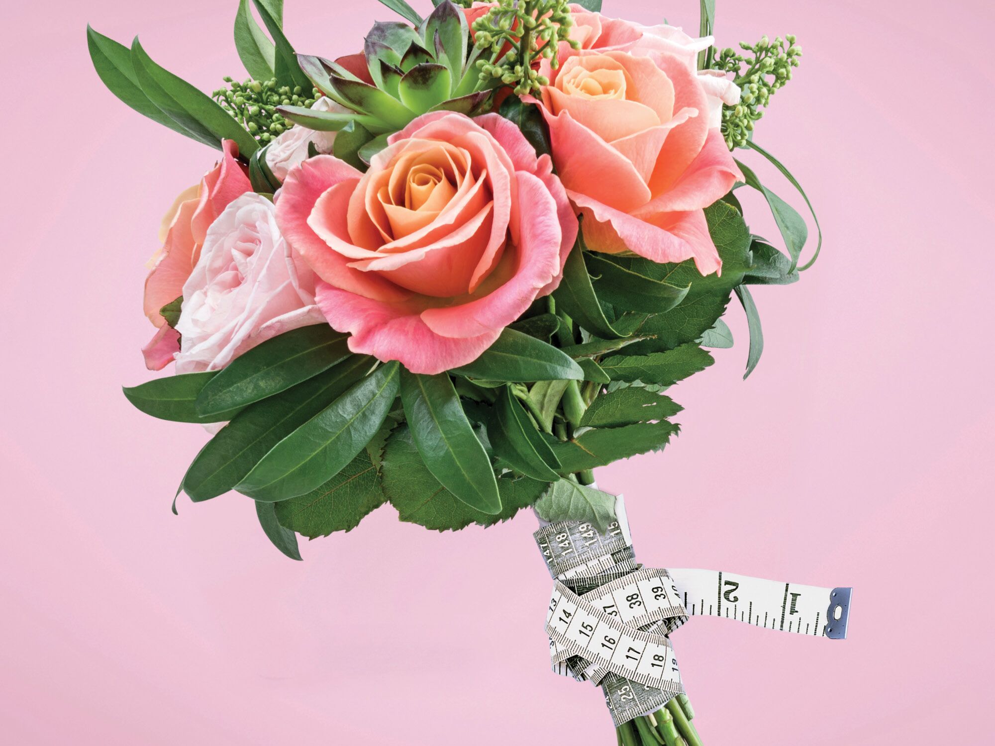 bouquet with measuring tape why we dont believe in the wedding diet by the knot editors 2024 planning issue