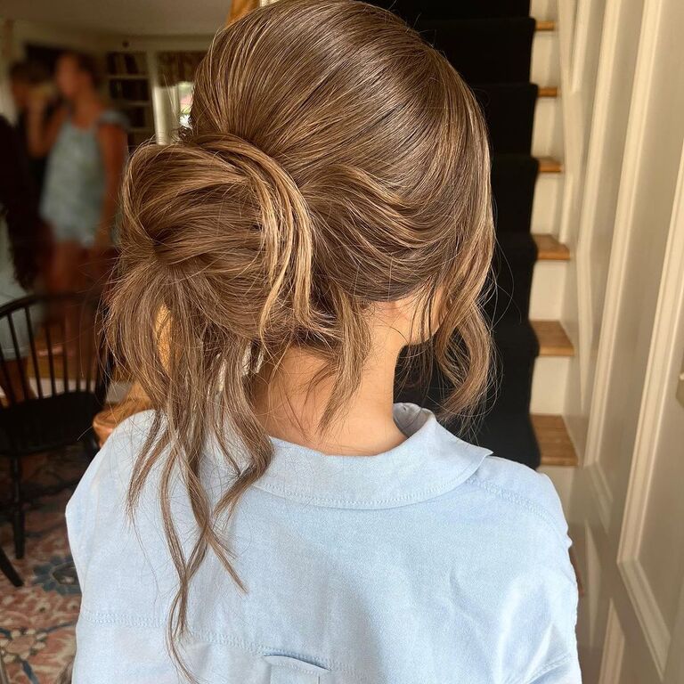 Loose bun bridesmaid updo hairstyle