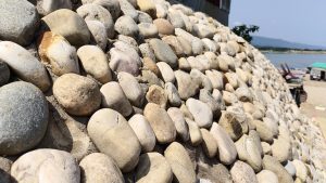 Rocks protecting the soil on the bank of a river