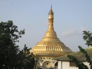 A golden dome crowns the Pagoda Temple Vipassana Centre Dhamma Ālaya Alate in Kolhapur District, radiating elegance.