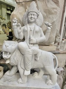 Beautifully carved goddess Durga statue in white marble. It’s not fully finished, but still showcasing divine artistry