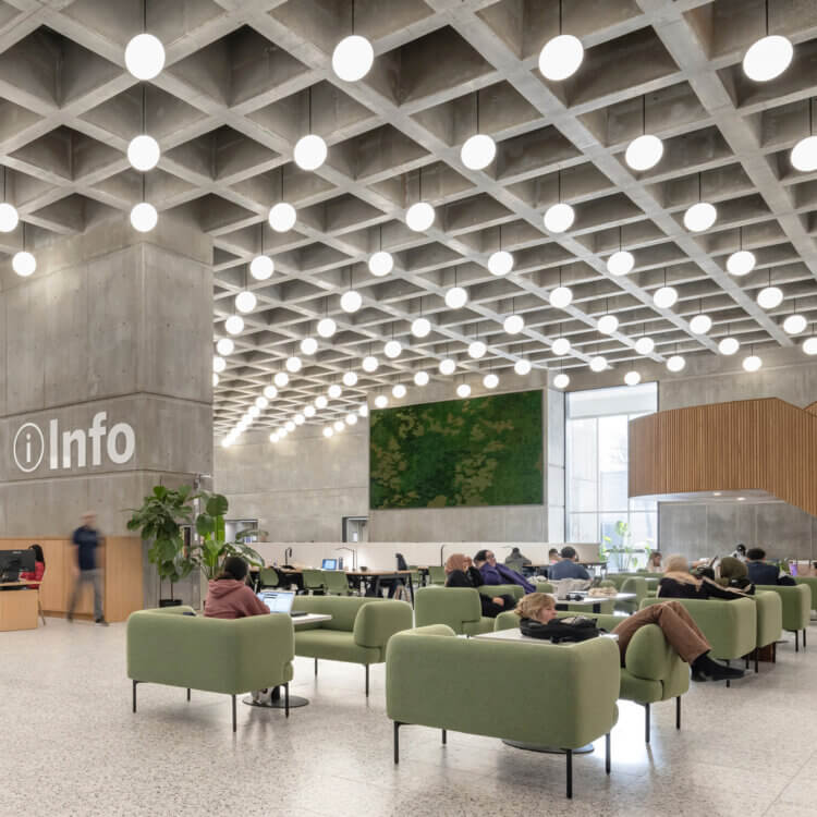 Library info desk surrounded by comfortable furniture