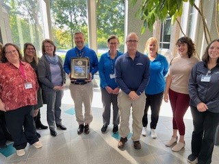 City of Springdale Health Department (Ohio) staff members pose with their PHAB accreditation Plaque.