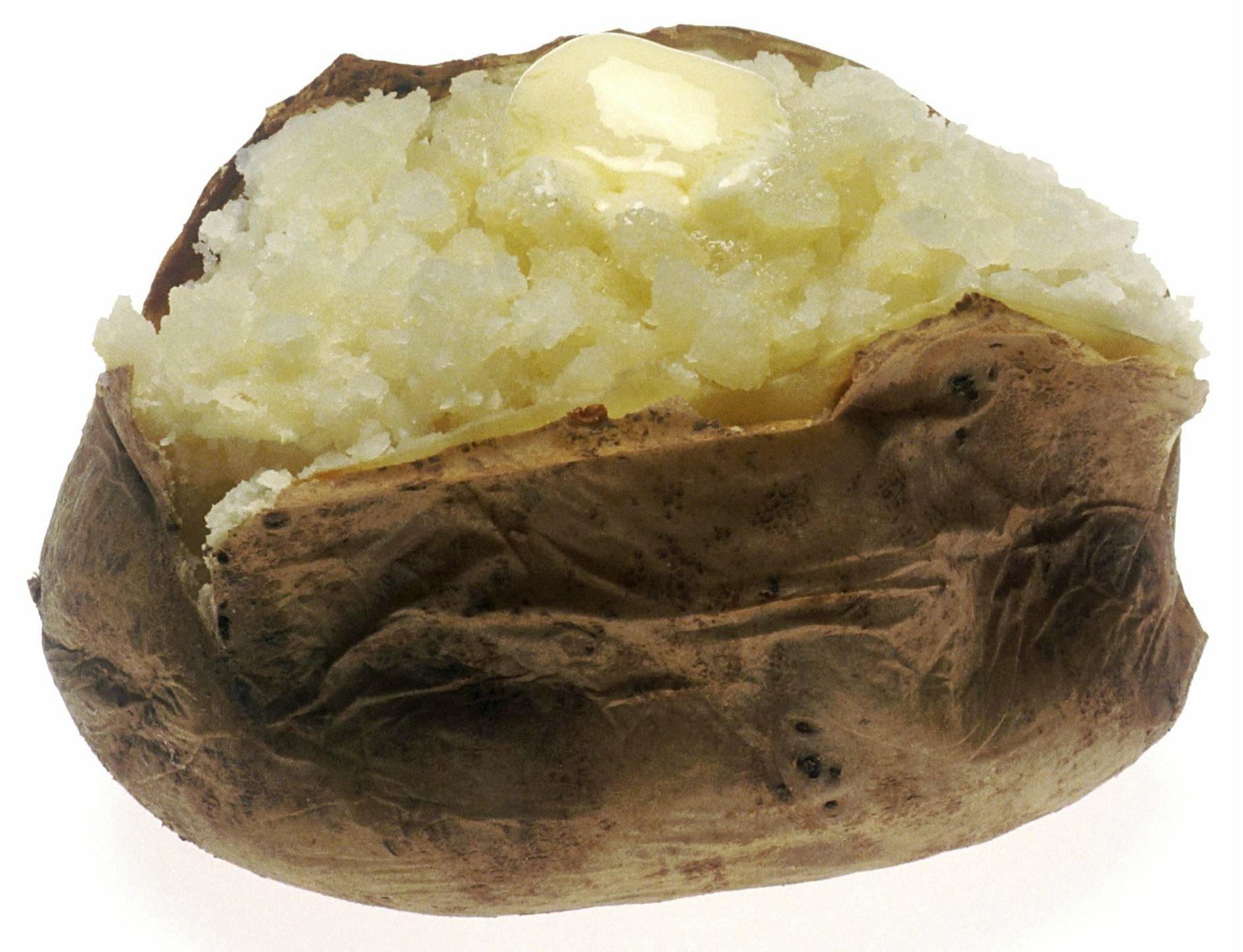 A baked potato with a fluffy, buttery interior, showcasing its rustic, brown skin. Enjoy this comforting food item as a delicious side or main dish.
