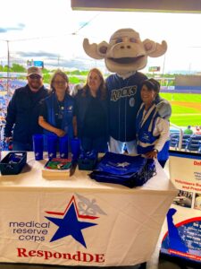 Photo of a RespondDE table at a Blue Rocks game