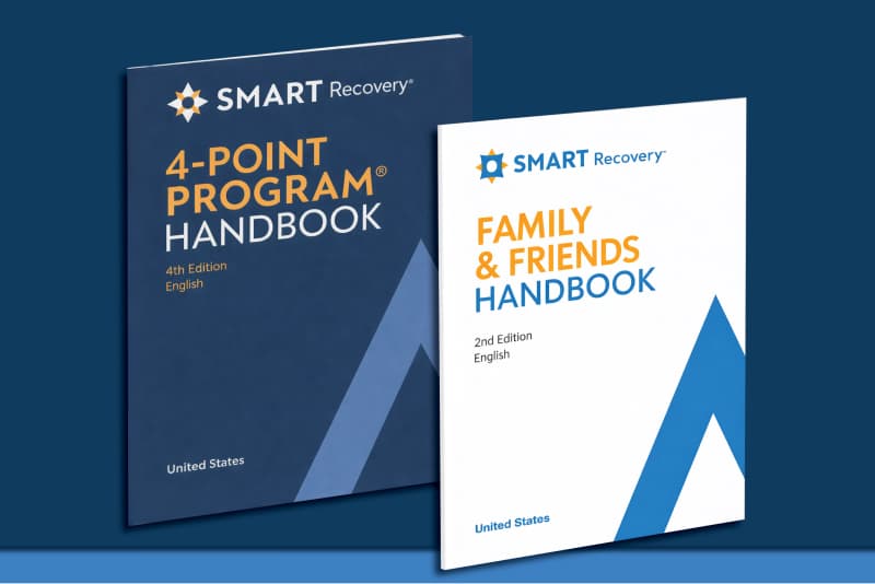 Two SMART Recovery handbooks, the blue 4-Point Program Handbook and white Family & Friends Handbook, displayed against a dark background.