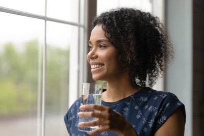 Woman holding a glass of water