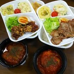 Aisle - On the left is a Cabbage Roll Bento, and on the right is a Chicken Tomato Stew Bento.