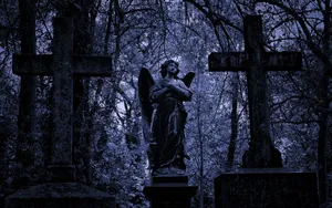 Engelstatue i en kirkegård Wallpaper