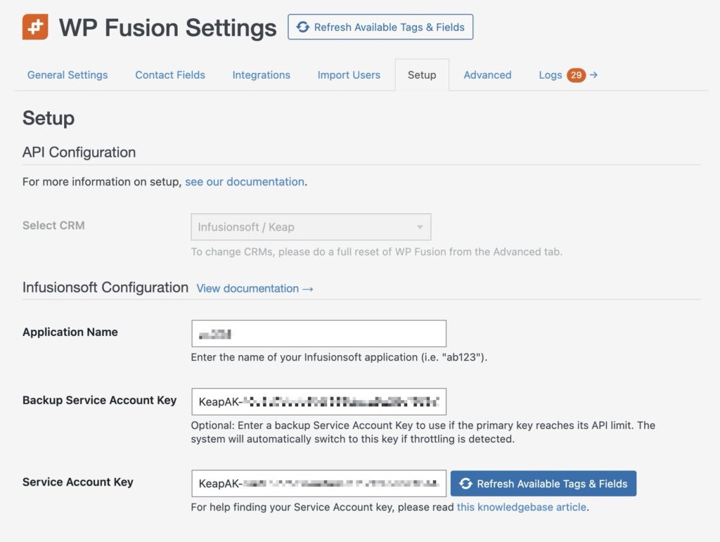 screenshot of the wp fusion settings page under the setup tab, seamlessly integrating keap. features include api configuration options for infusionsoft, fields for infusionsoft account url, backup, and service account keys, with blurred text ensuring security on your wordpress site.