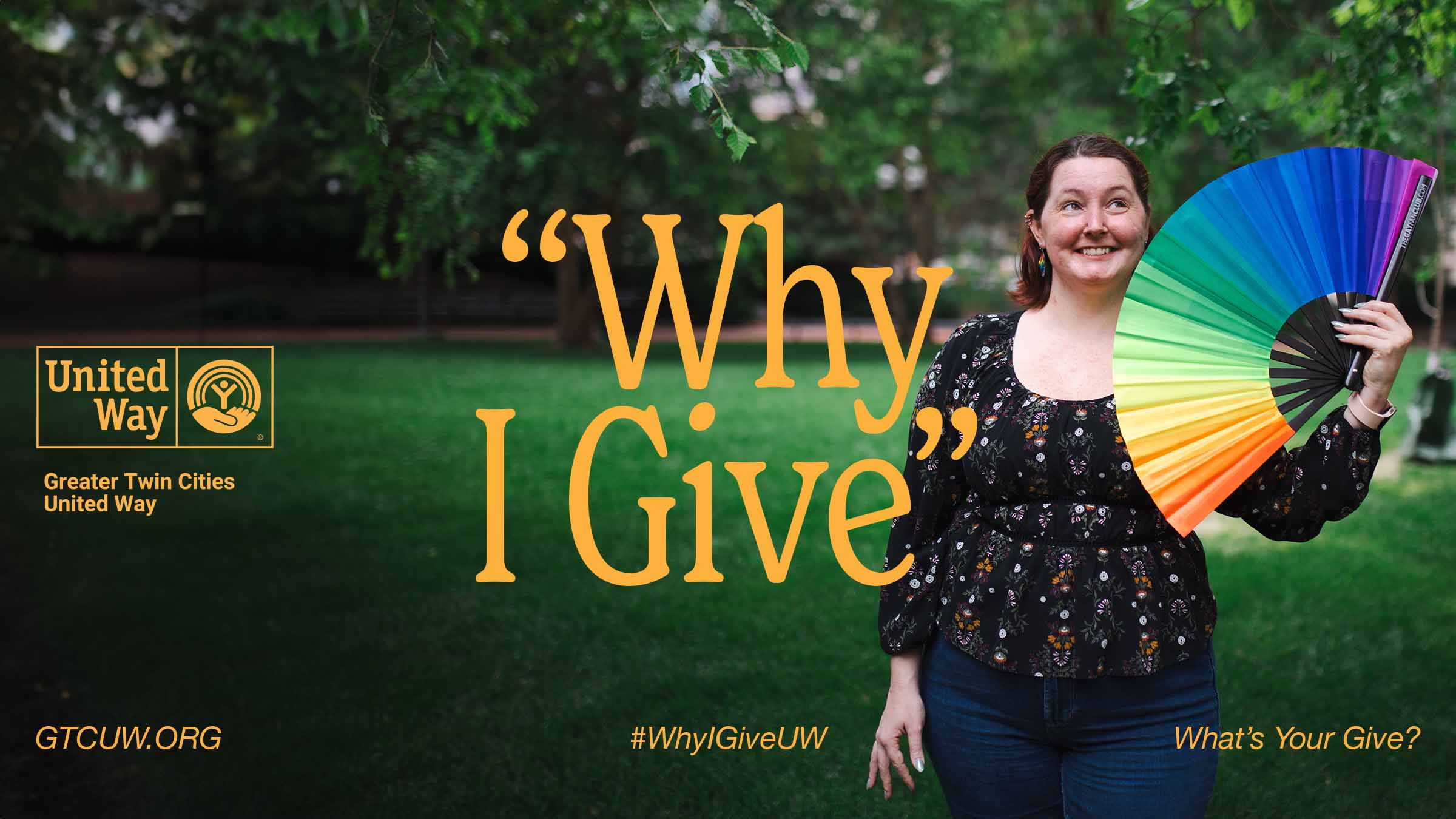 Sarah Sheppard stands in a park holding up a colorful rainbow fan with the words "Why I Give" overlayed