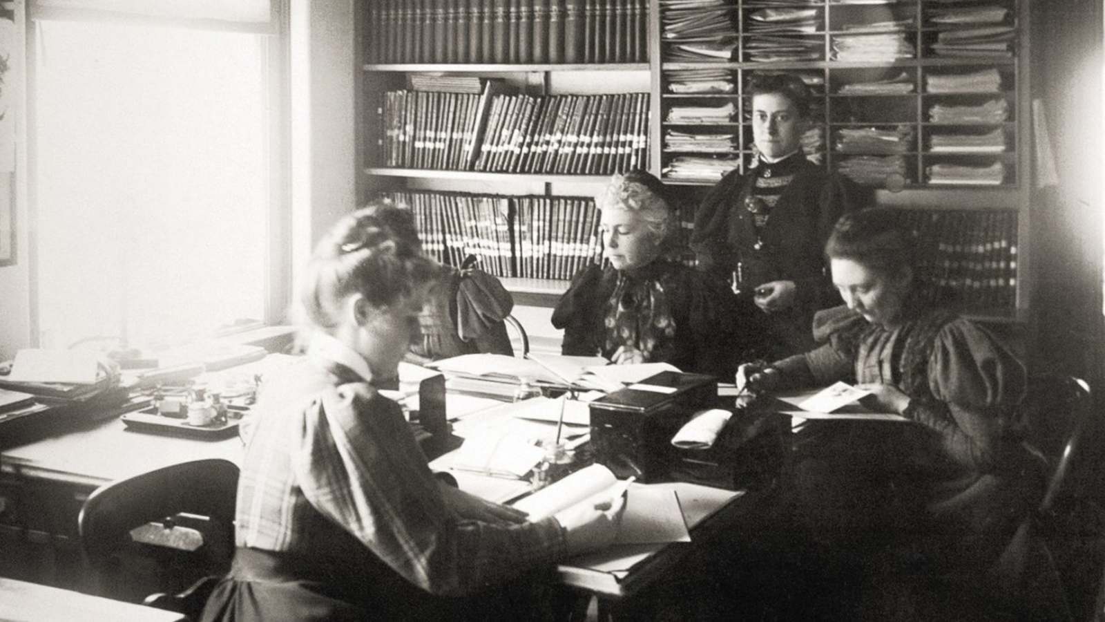 An old photo of women working at a desk