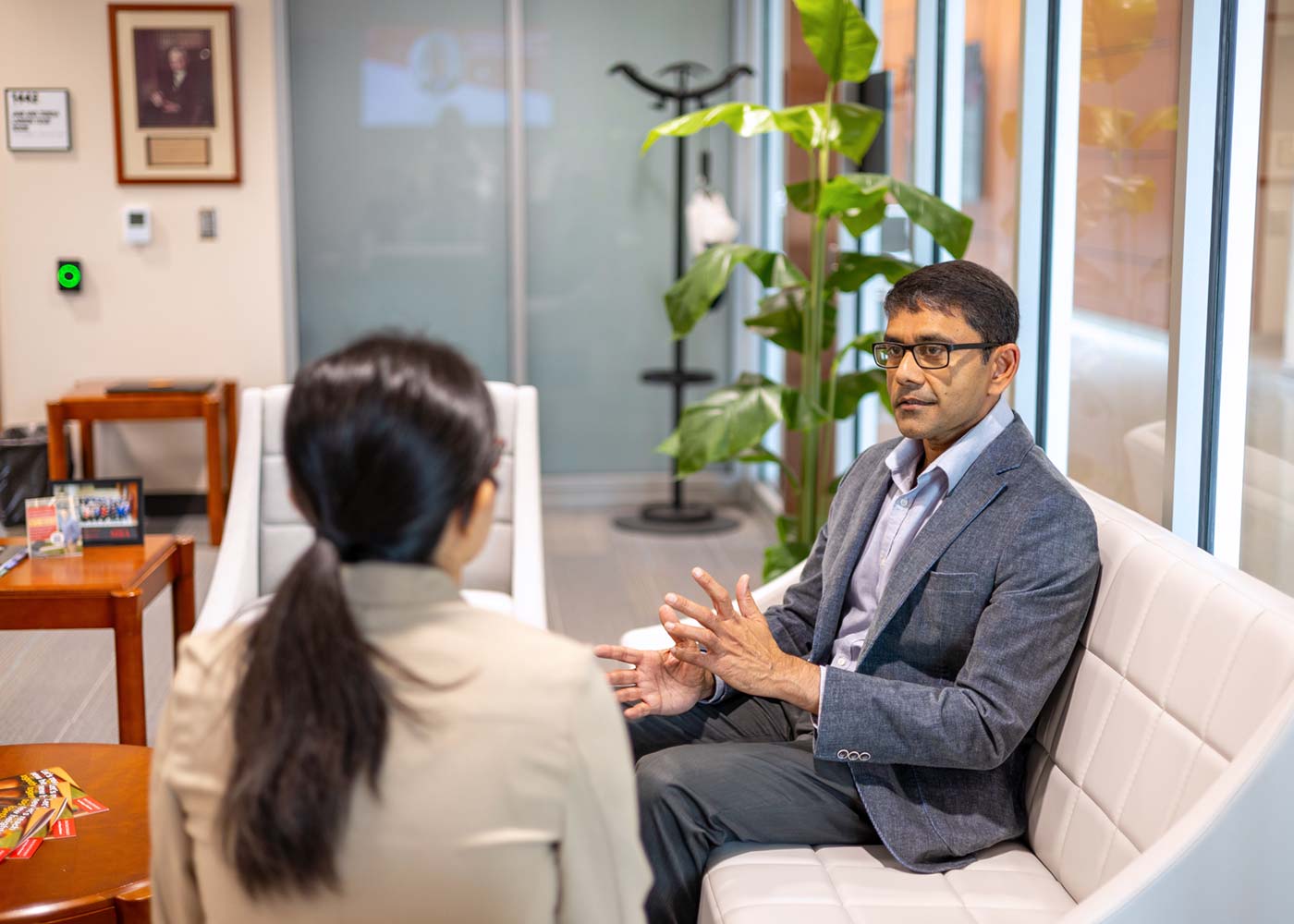 Kaushik Gala conversing wtih fellow PhD candidate at the Ivy College of Business.